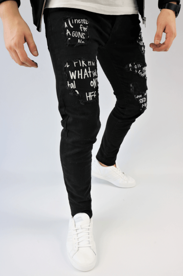 Spodnie jeansowe męskie rurki czarne z białymi napisami i dziuarmi w kolanach