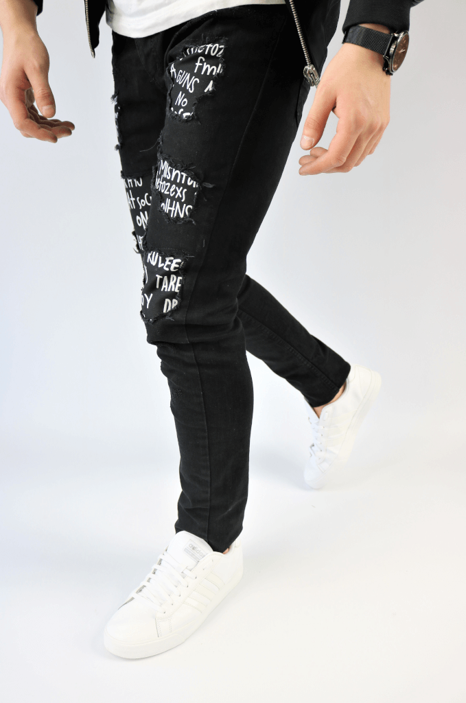 Spodnie jeansowe męskie rurki czarne z białymi napisami i dziuarmi w kolanach