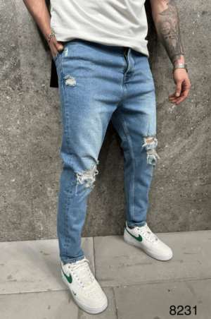 Szerokie spodnie Jeansowe męskie w niebieskim kolorze z dziurami na kolanach