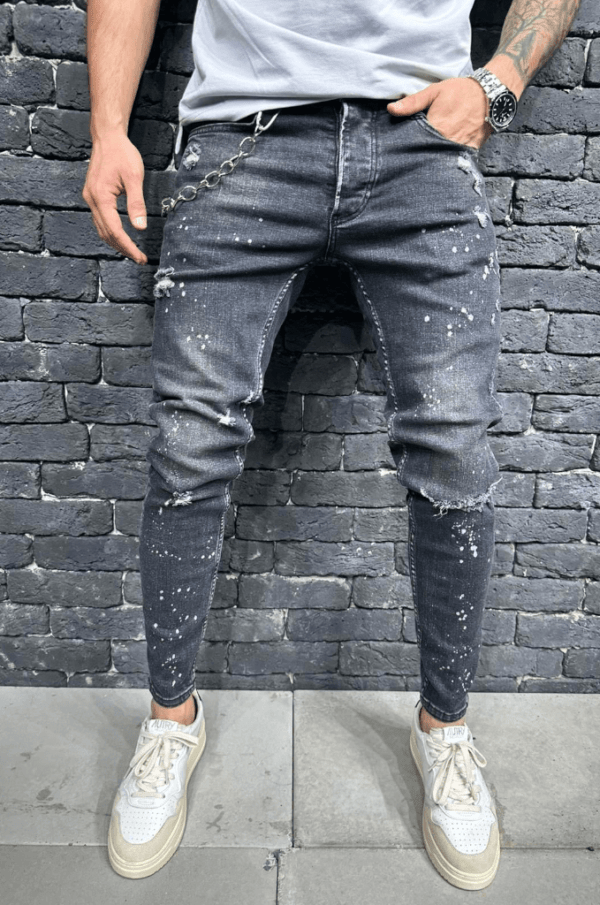 Spodnie Jeansowe męskie typu rurki z plamami farby na nogawkach oraz z dziurami na kolanach Spodnie szare z łańcuchem