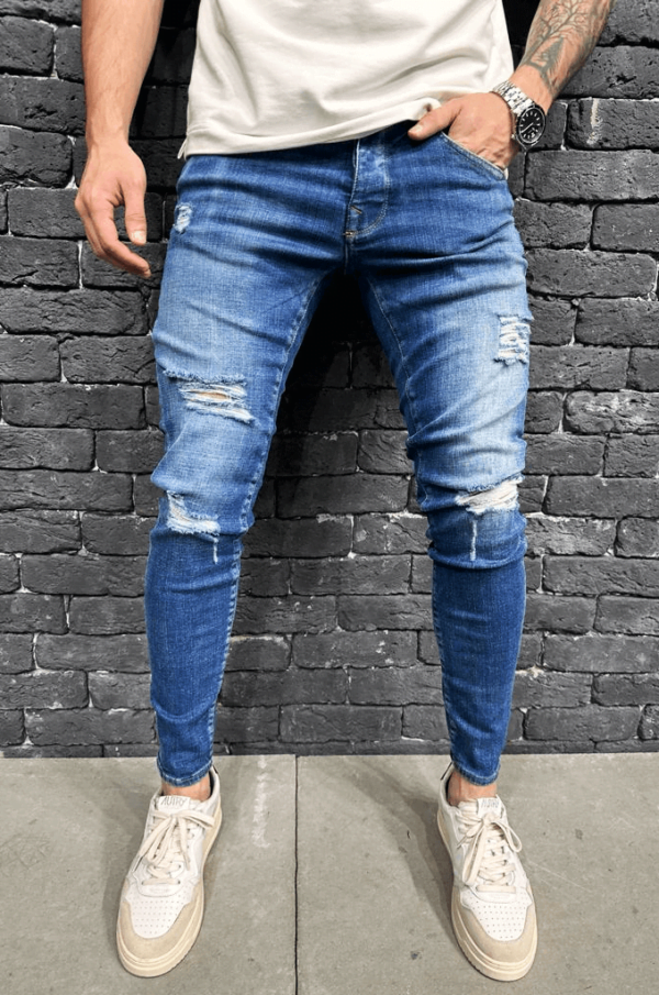 Spodnie Jeansowe męskie rurki w niebieskim kolorze z dziurami na kolanach