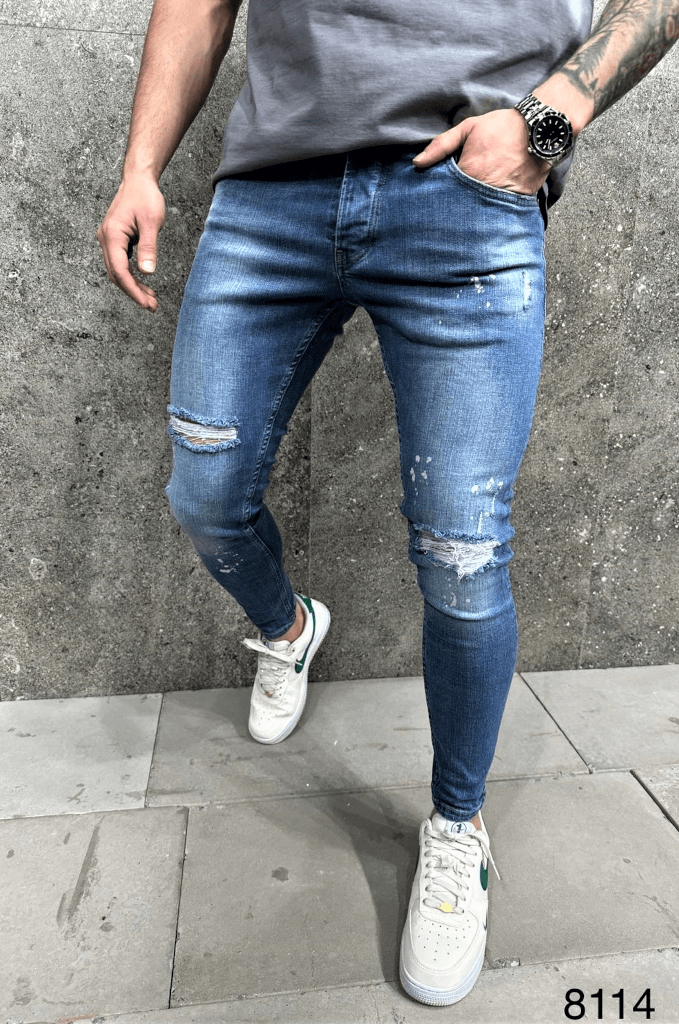 Spodnie jeansowe męskie niebieskie z przetarciami i plamami farby