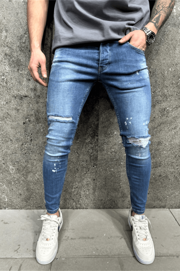 Spodnie jeansowe męskie niebieskie z przetarciami i plamami farby