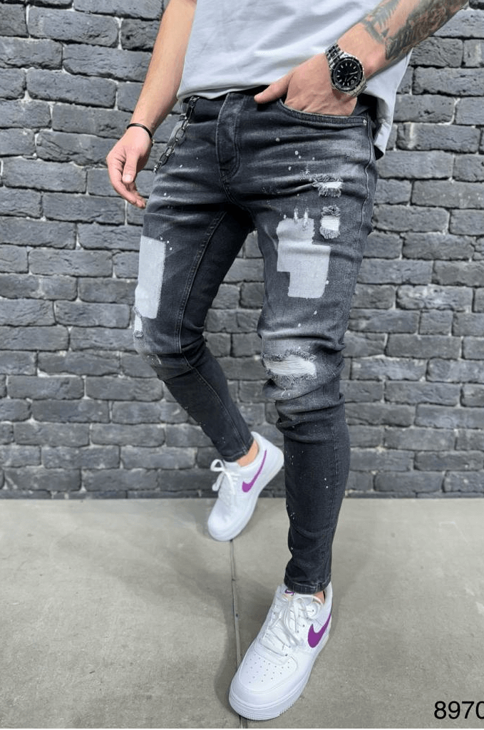 Czarne spodnie jeansowe męskie z plamami farby i łatami