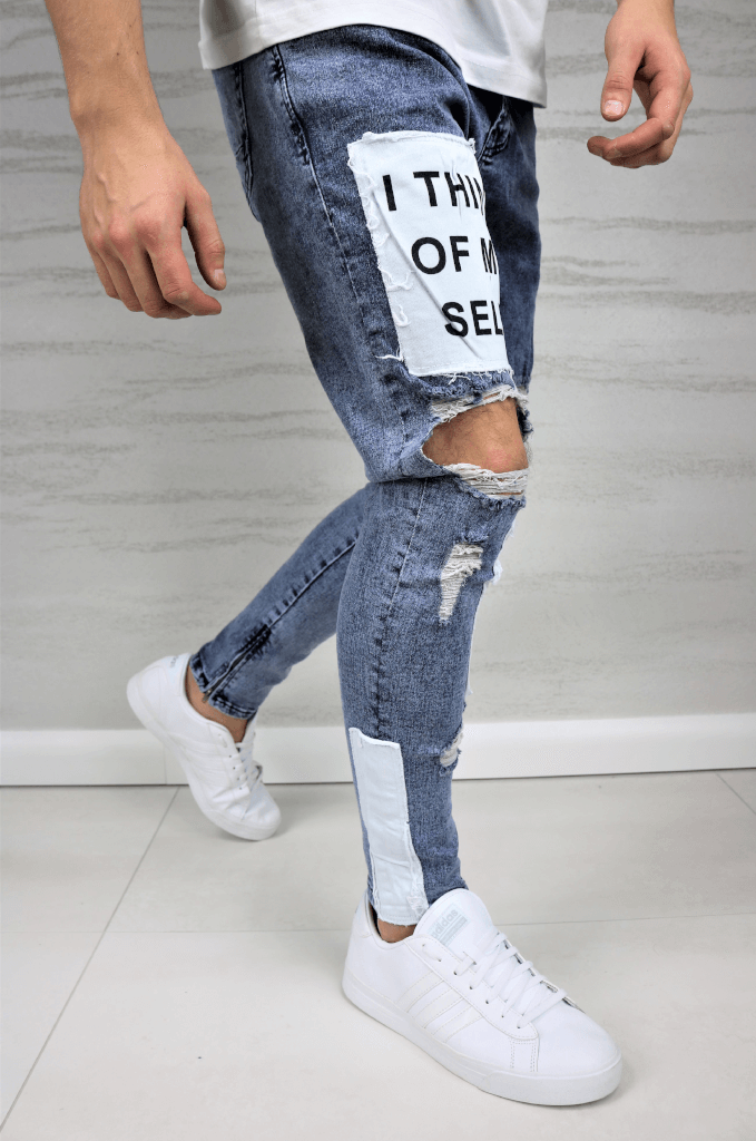 Spodnie jeansowe męskie niebieskie z dziurami w kolanach i nadrukiem